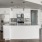 a kitchen with white cabinets