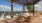 a rooftop patio with tables and chairs