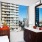 Bathroom with white countertops and windows