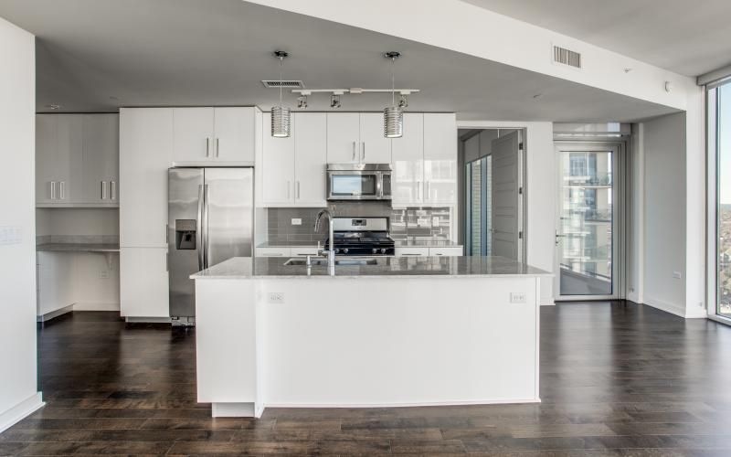 a kitchen with white cabinets