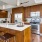 a kitchen with wooden cabinets