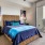 a bedroom with a large window