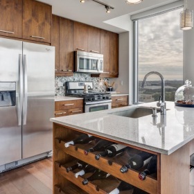 Beautiful kitchens with designer finishes a kitchen at The Bowie with a stainless steel refrigerator