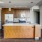 a kitchen with wooden cabinets