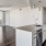 a kitchen with white cabinets