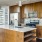 a kitchen with wooden cabinets